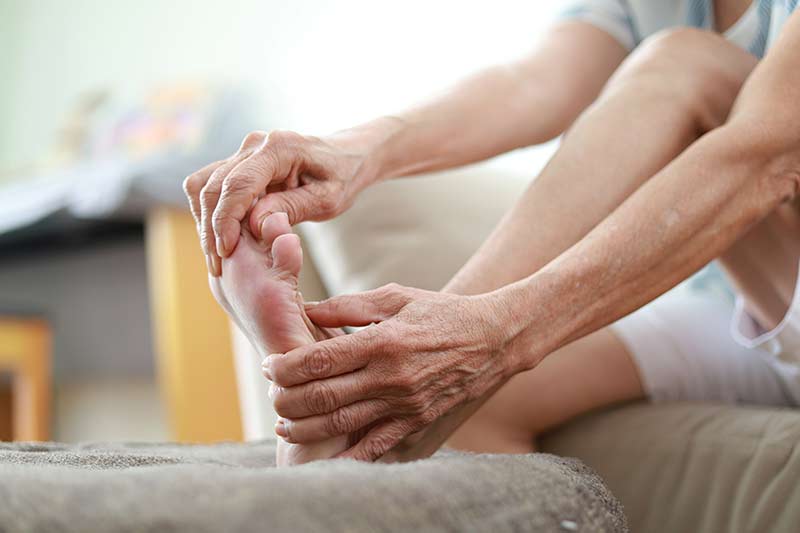 A person examining their feet