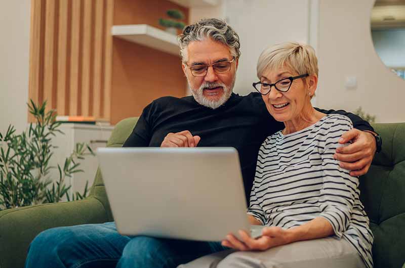 Couple using a laptop