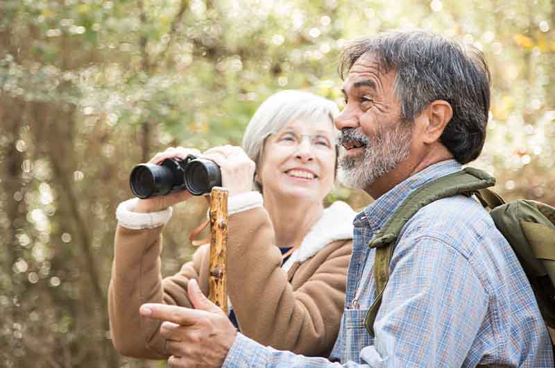 Couple looking through binoculars 