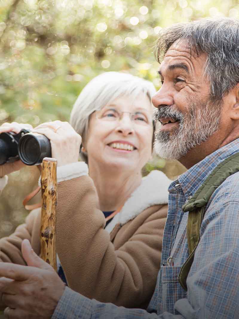Couple using binoculars