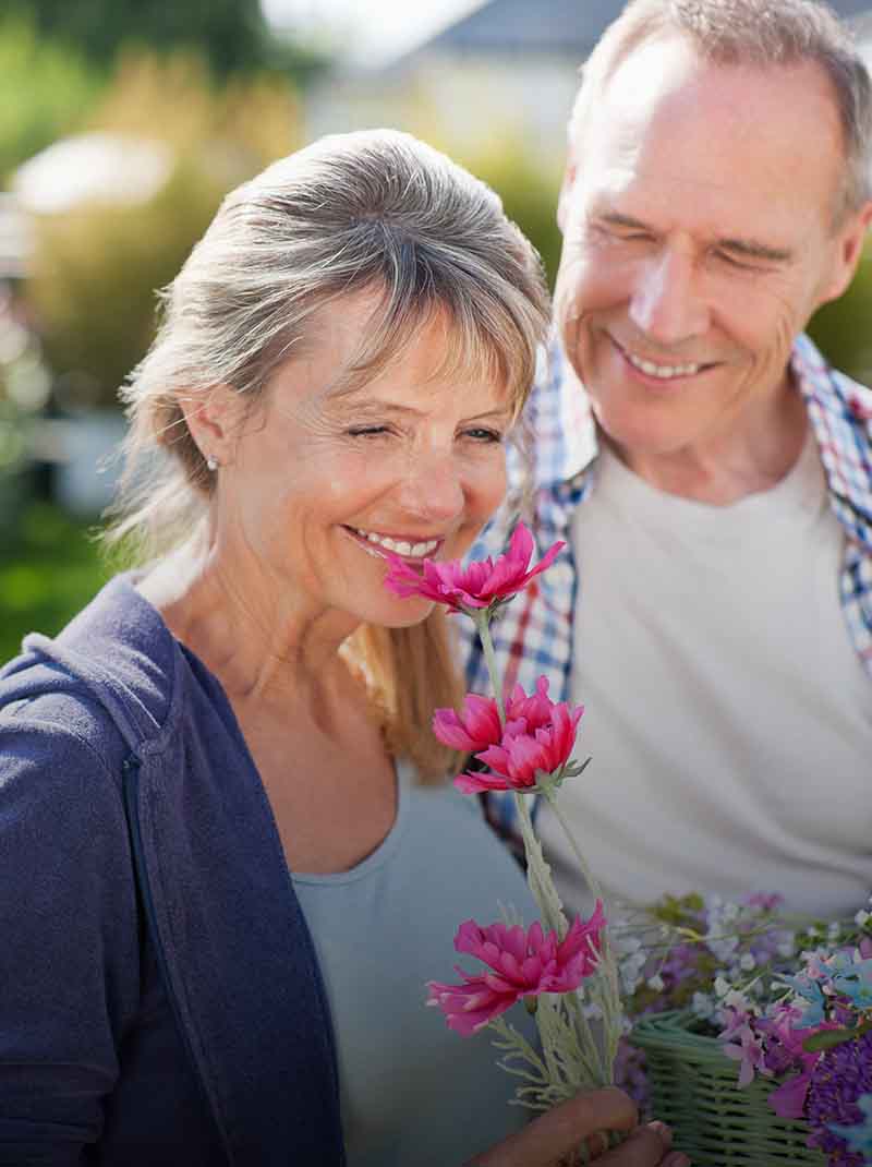 Woman smelling flowers